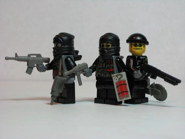 Slide76.jpg Photograph of three LEGO minifigs dressed as thieves